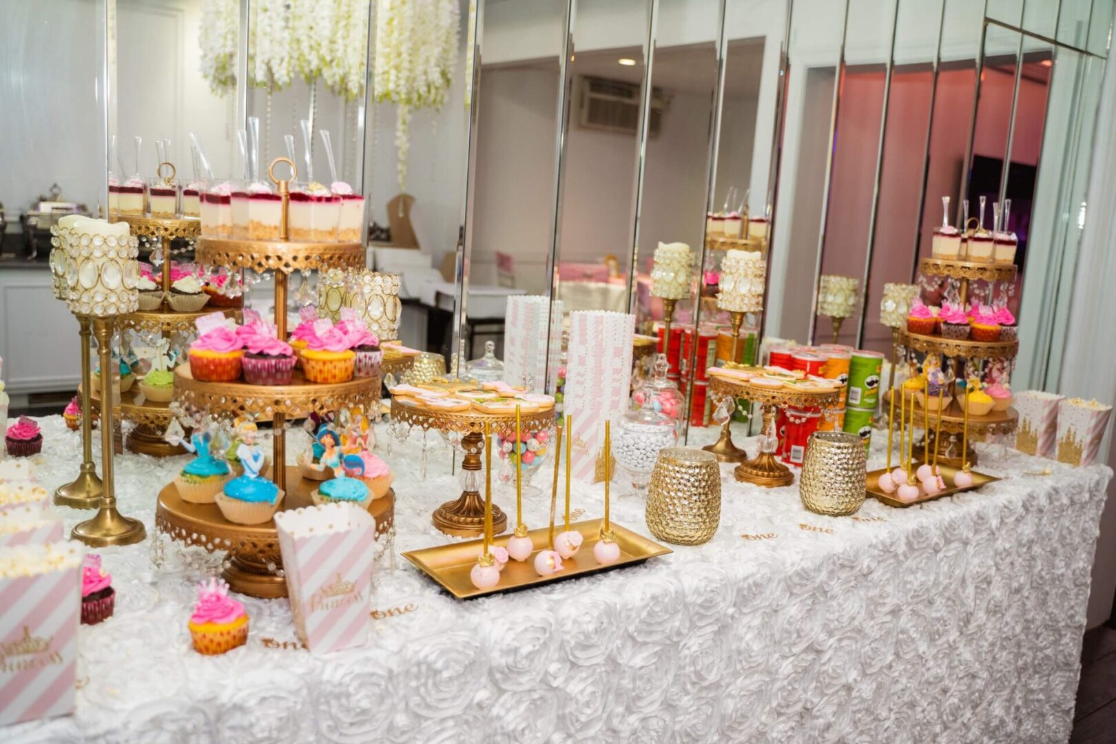 A table with many different types of cakes on it