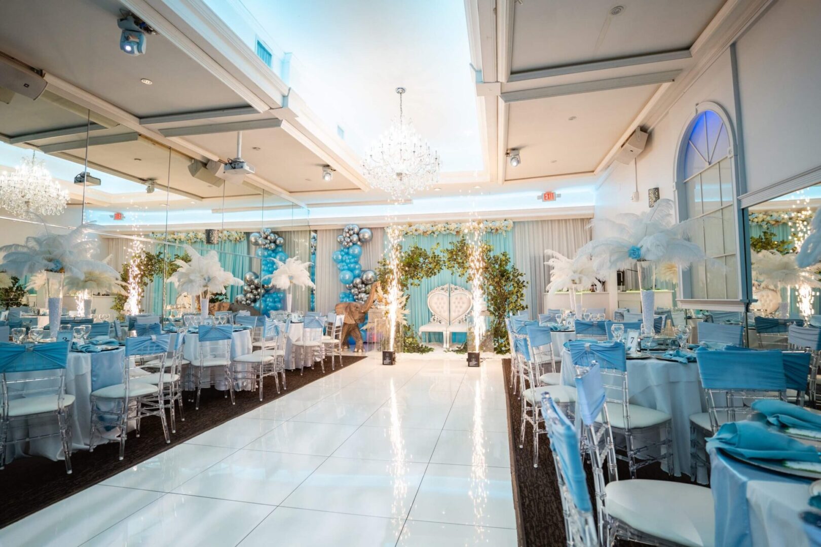 A banquet hall with tables and chairs set up for an event.