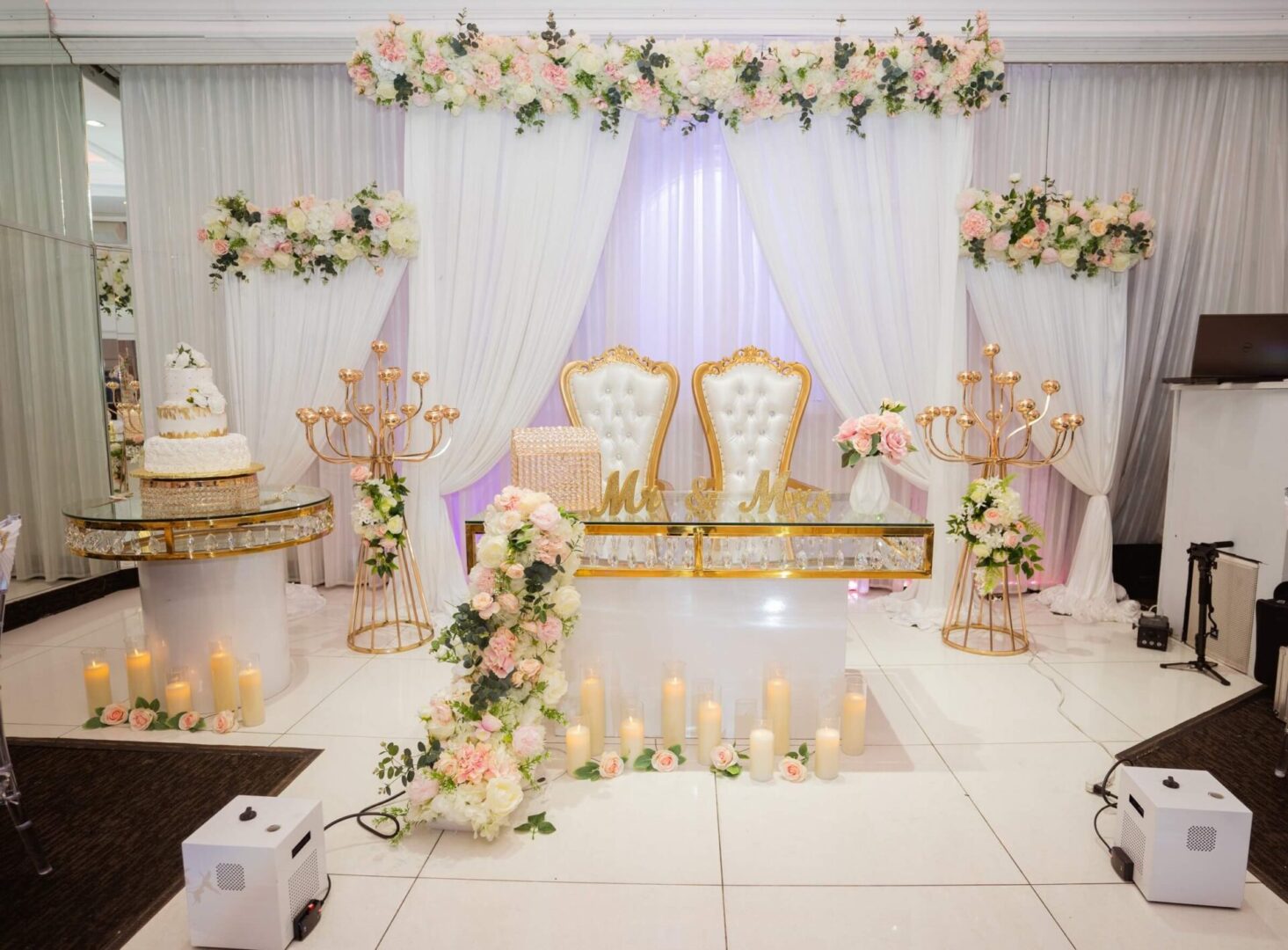 A wedding set up with candles and flowers.