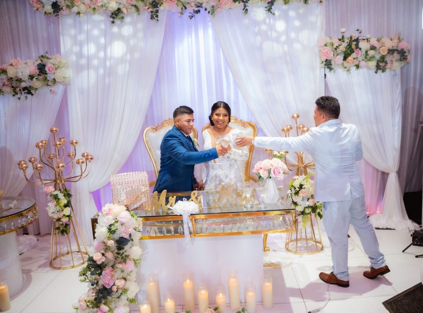 A couple getting married in front of the bride and groom.